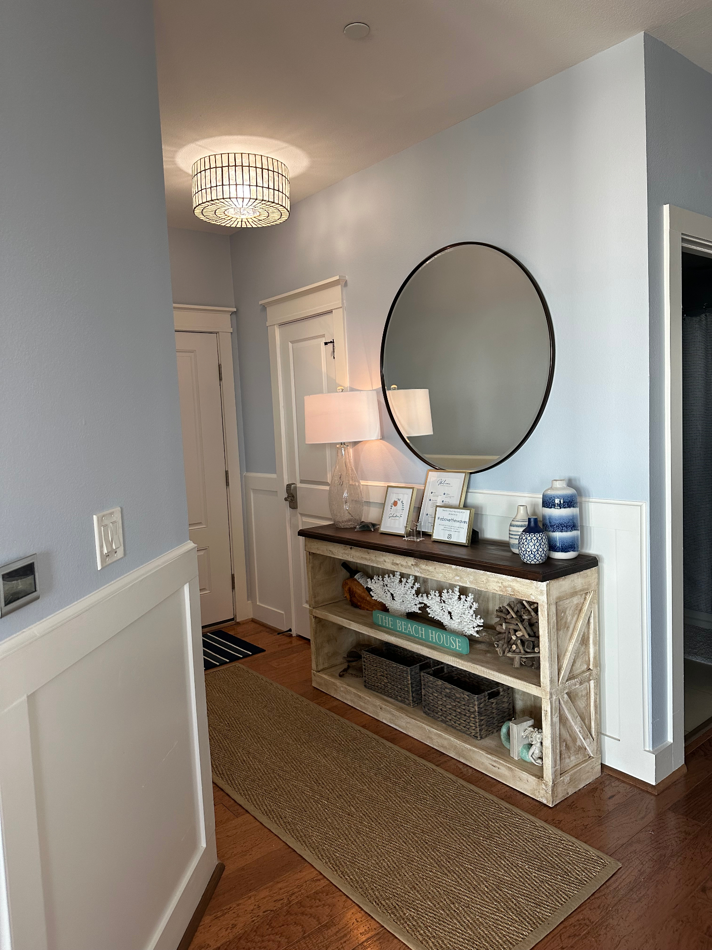 Condo entryway with coastal decor