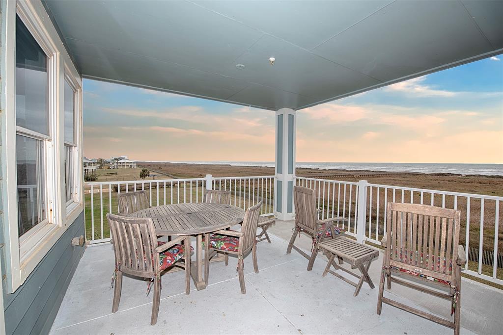 Front balcony dining table with sunset gulf view