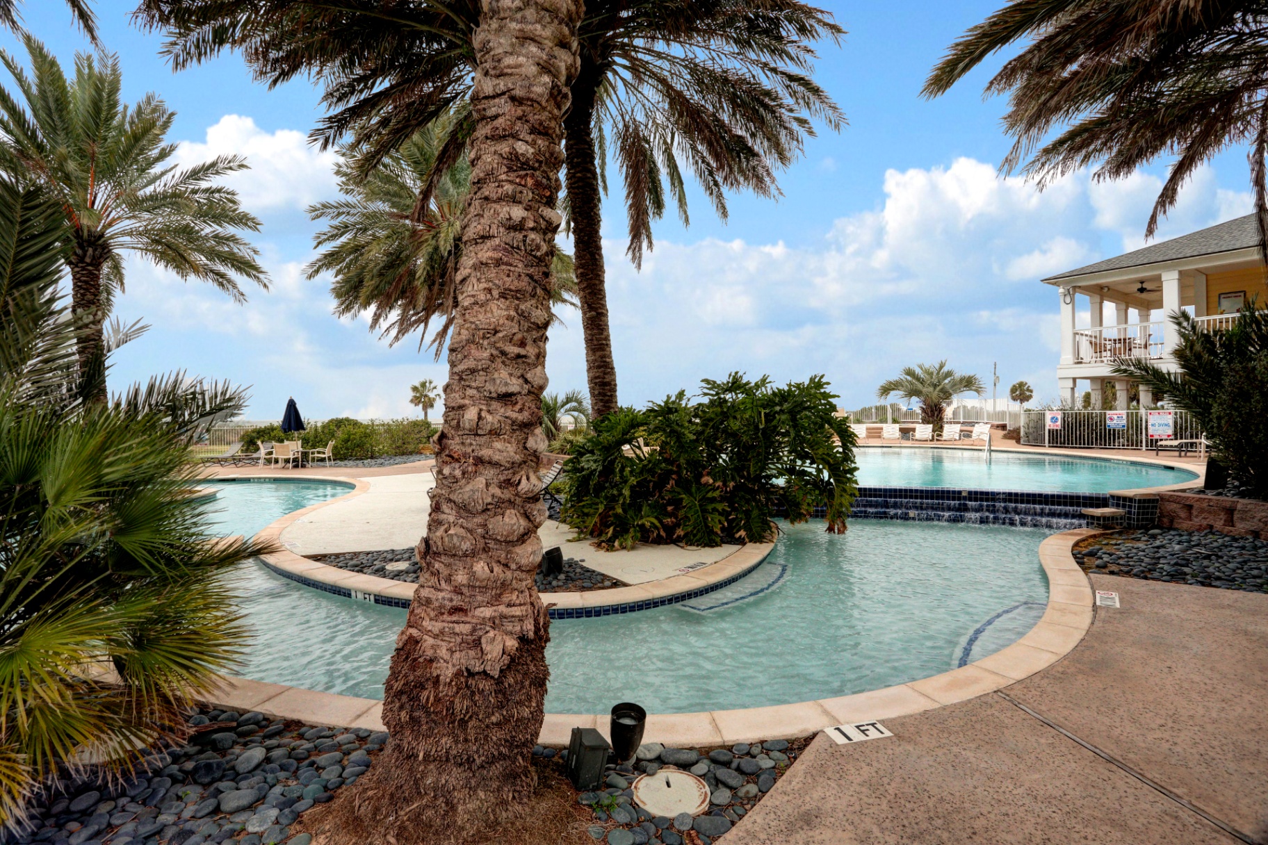 Bay side pool deck with water views